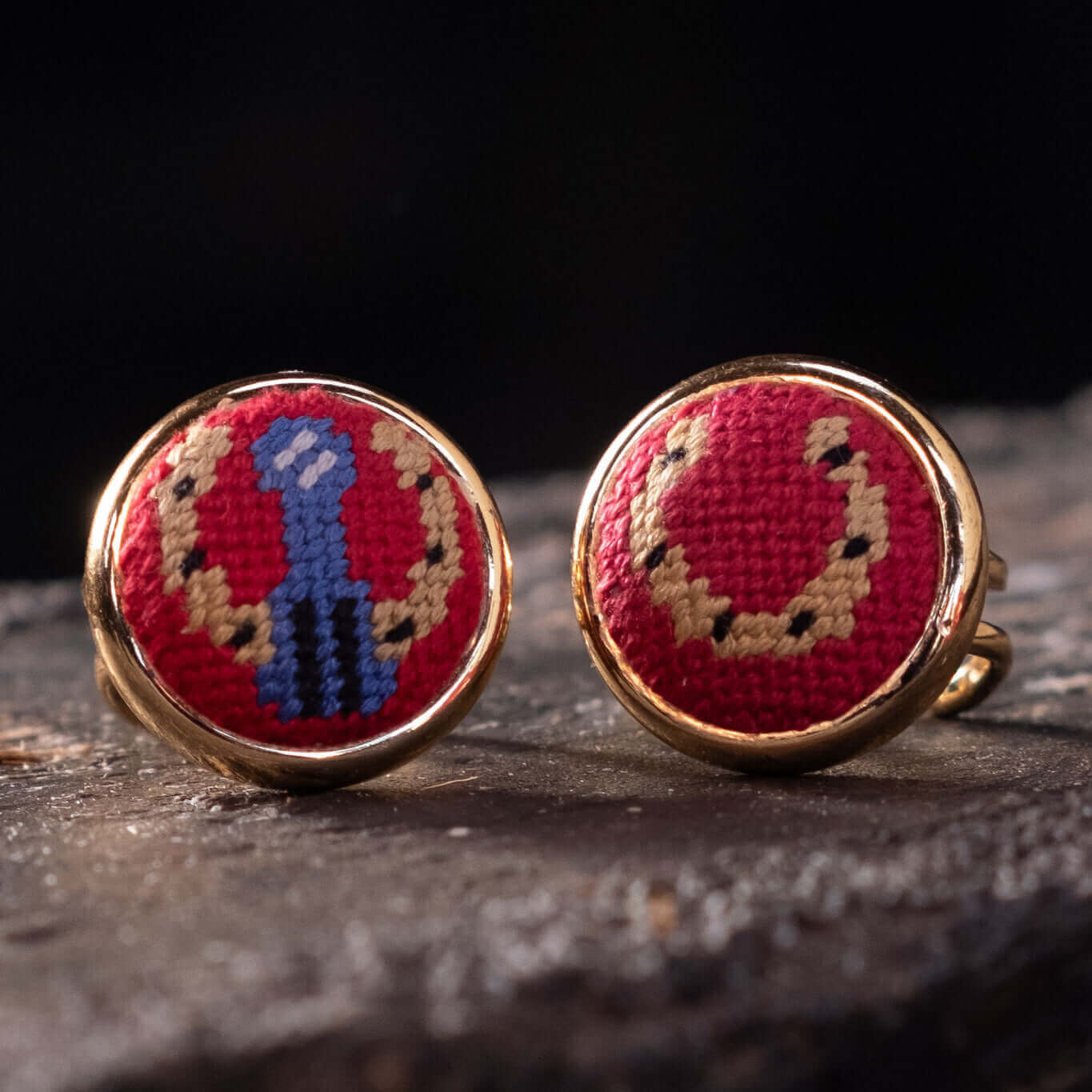 Close-up of the Red Horseshoe Needlepoint Ring, featuring a vibrant red design with gold accents, perfect for horse lovers.