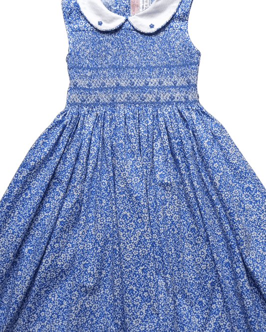 Smocked blue anemone dress with white collar, perfect for spring and summer, showcasing exquisite craftsmanship and comfort.