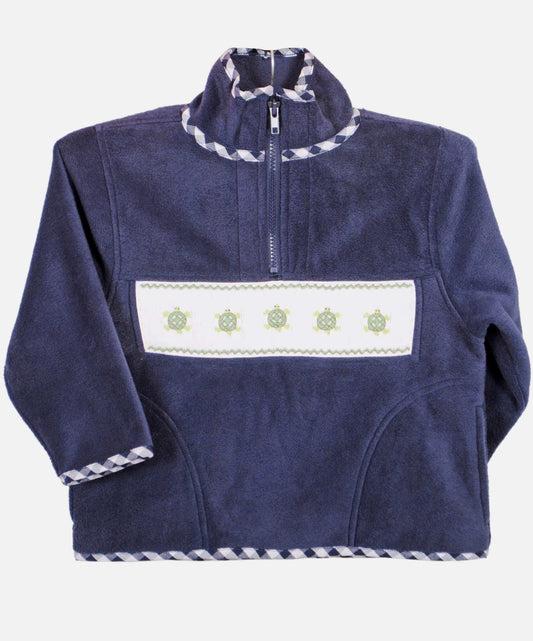 Super soft navy polar fleece jacket with a hand smocked turtle motif and charming gingham trim. Perfect for the changing seasons!