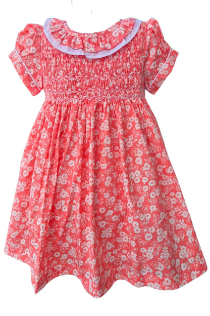 Coral floral hand-smocked dress with ruffle collar, perfect for Easter or special occasions.