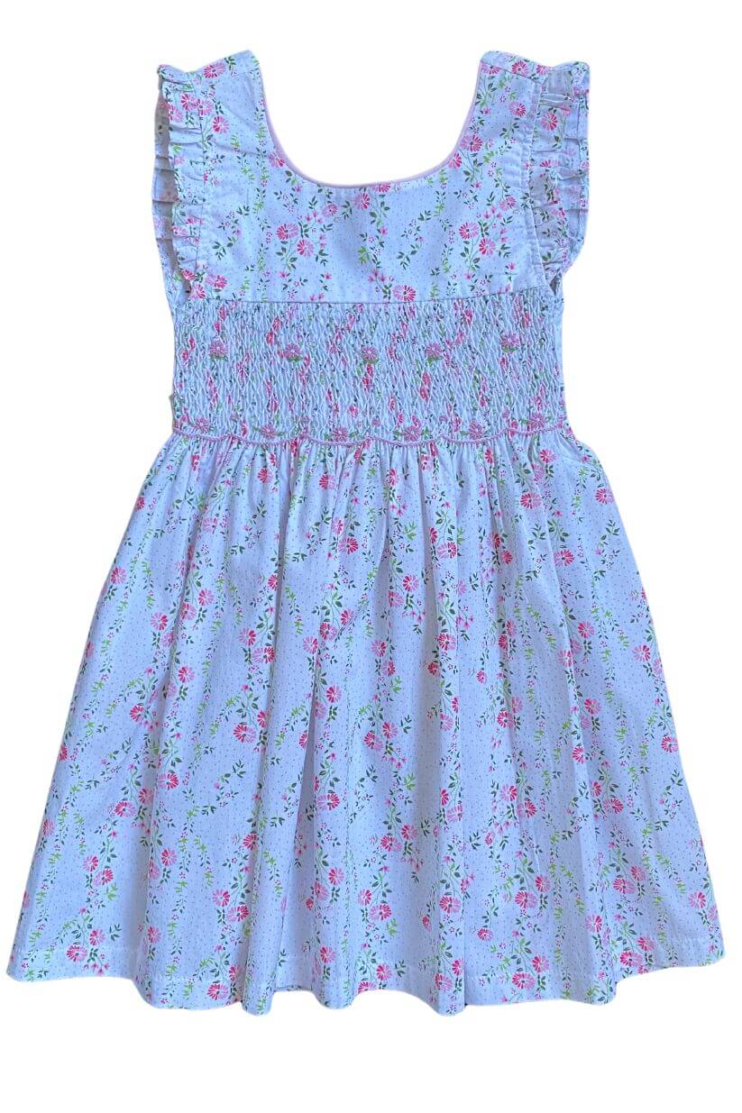 Hand-smocked blue floral dress with flutter sleeves, showcasing delicate embroidery and charming craftsmanship.