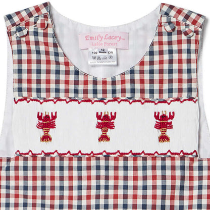 Smocked Lobster John John with playful lobster motifs on a red, white, and blue checked design, perfect for summer fun.