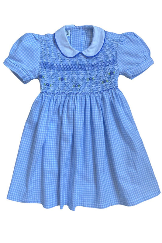 Lightweight smocked flannel gingham dress in blue, perfect for school photos and special occasions.