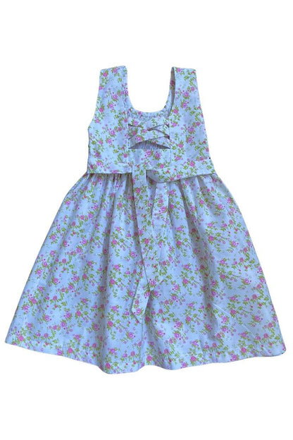 Adorable hand-smocked pink and green floral dress with crisscross back, perfect for spring outings.