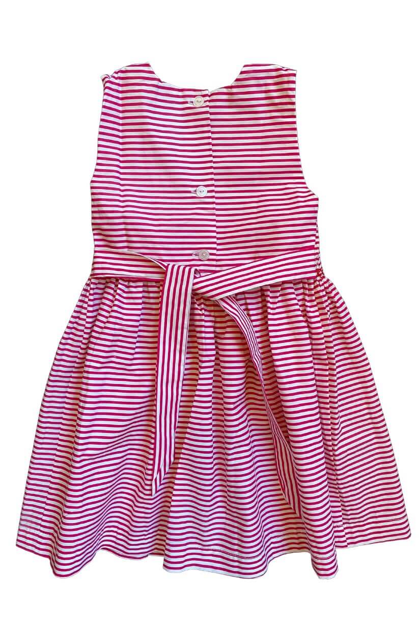 Smocked red striped boat dress with a back tie, perfect for little girls' seaside adventures.