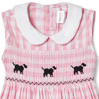 Hand-smocked gingham dog dress in pink with puppy embroidery and white collar for toddlers.