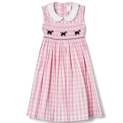 Adorable hand-smocked gingham dog dress for toddlers, featuring cute puppy designs and a charming collar.