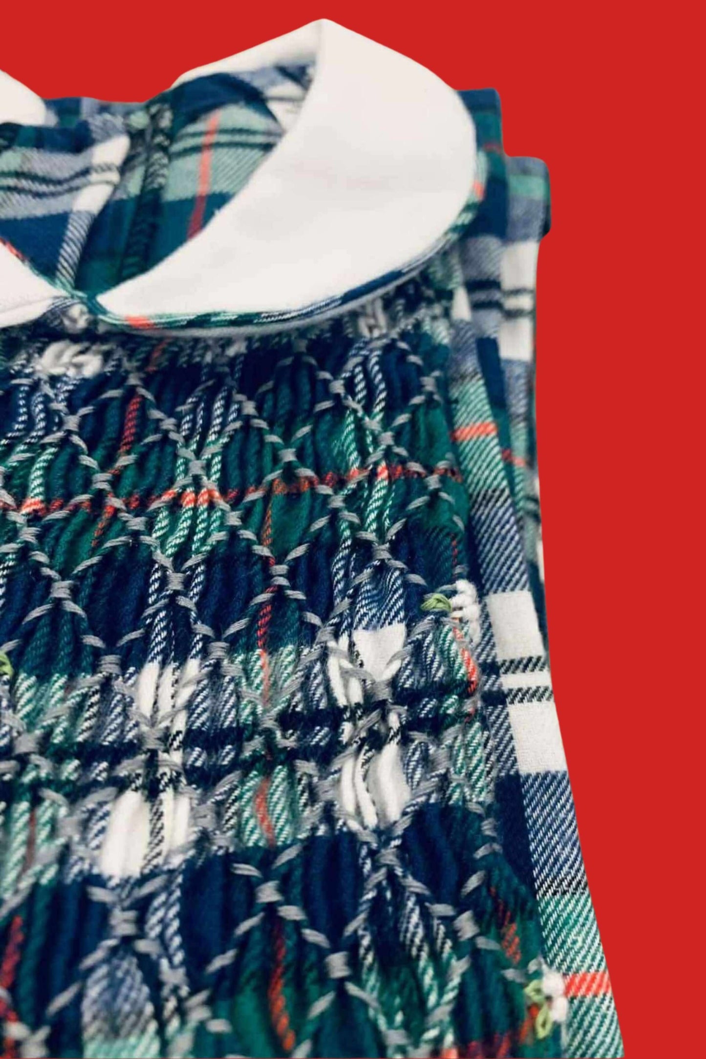 Sample Smocked Holiday Plaid Dress showcasing hand-smocked details and classic plaid design.