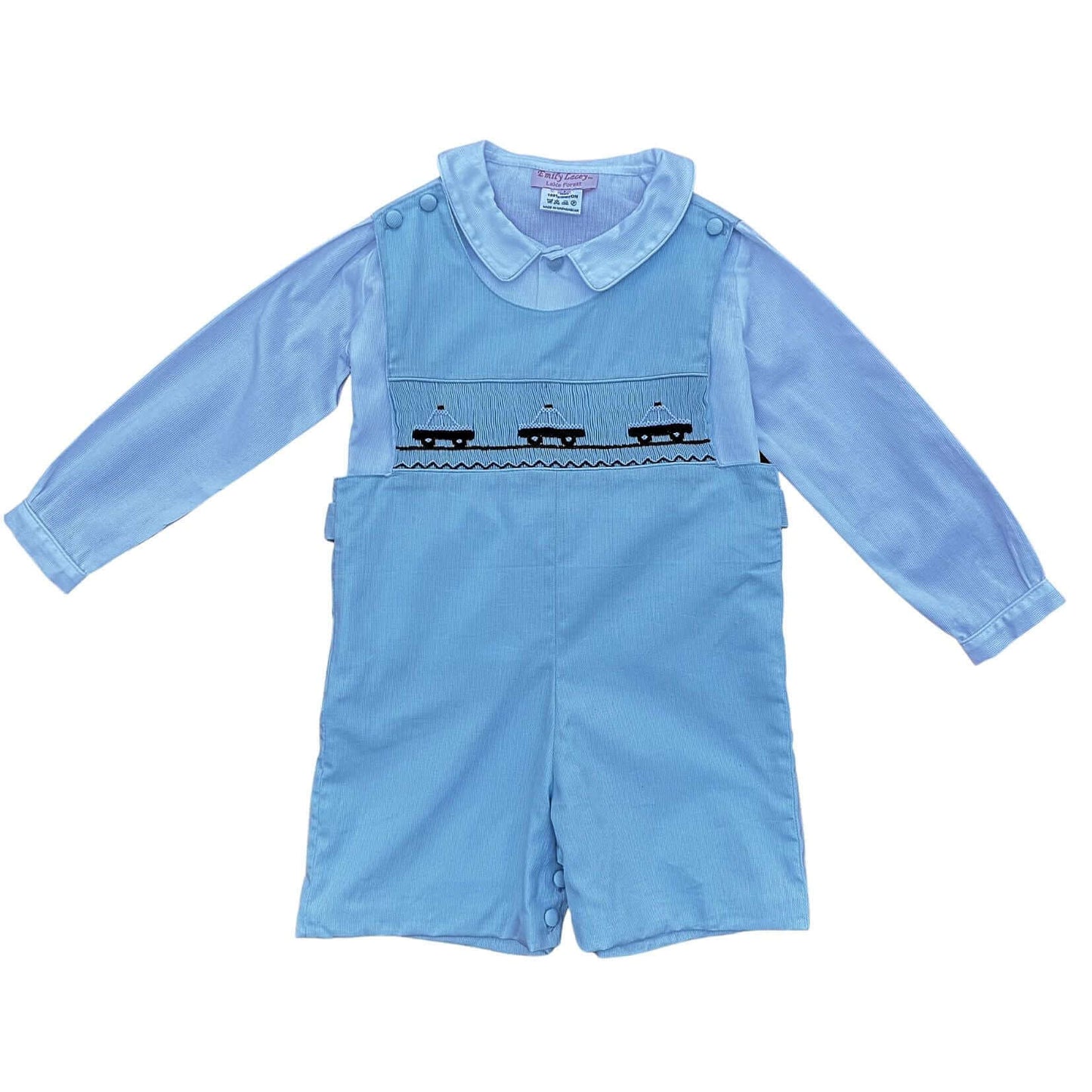 Smocked Police Car John John outfit with hand-smocked police car design, covered buttons, blue trim, and included shirt for boys.