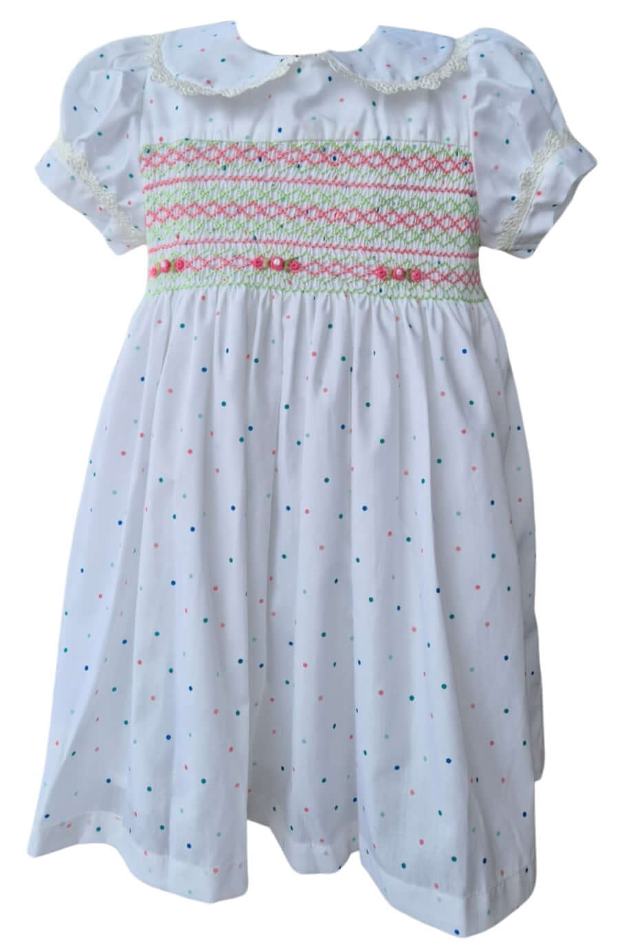 Hand-smocked petit pois dress in white cotton with polka dots, featuring floral embroidery, perfect for Easter.