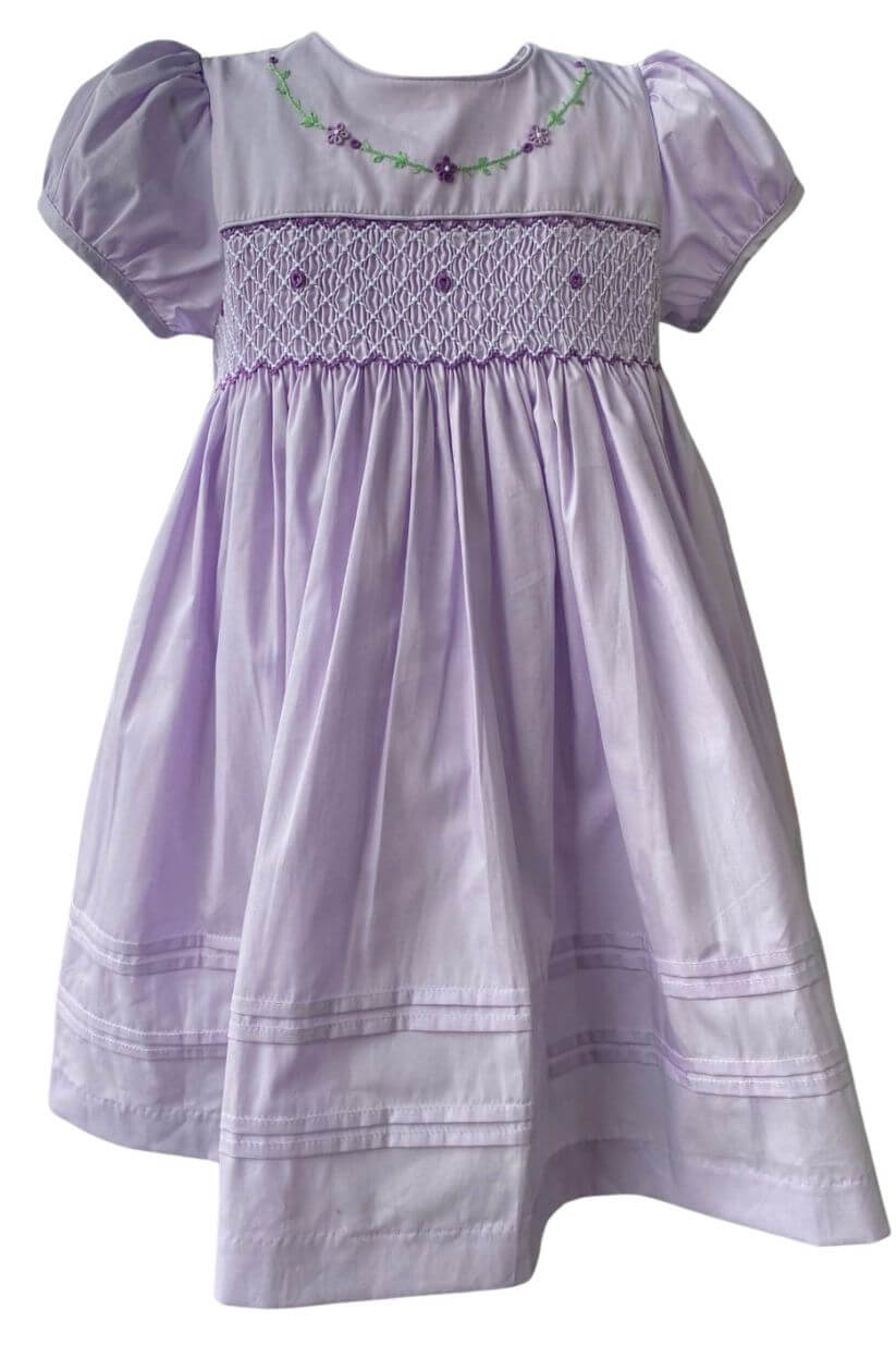 Elegant violet hand-smocked dress with floral embroidery, perfect for special occasions.