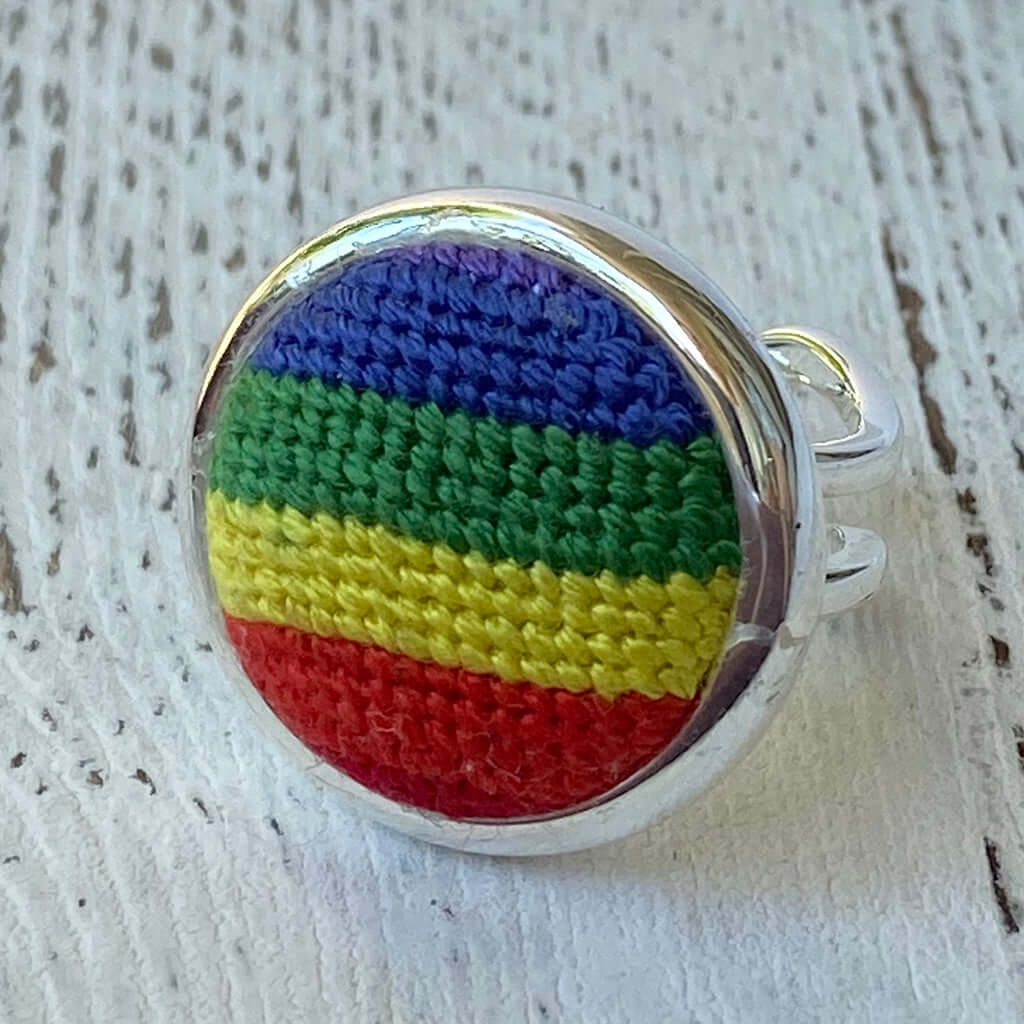 Pride Rainbow Needlepoint Ring with adjustable design, perfect as a scarf or purse charm; multicolor bands on silver ring.