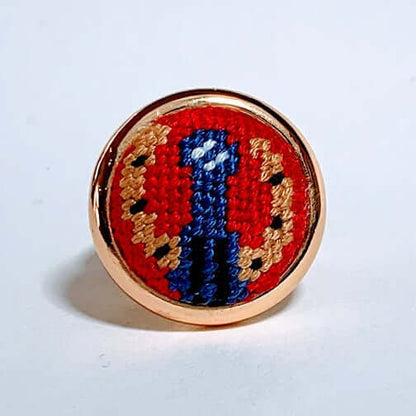 Blue Ribbon Needlepoint Ring featuring vibrant embroidery set in a stylish gold-tone frame, perfect for horse lovers.