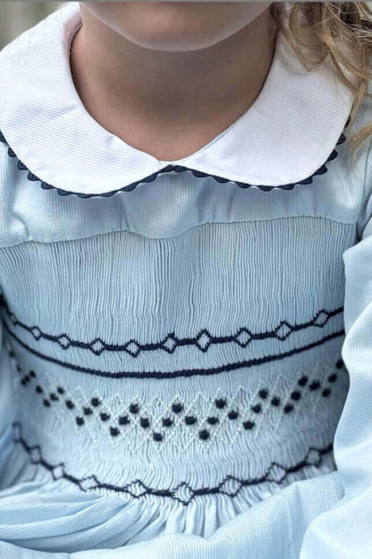 Elegant Smocked Sky Blue Geo Dress with hand-smocked bodice, perfect for school photos and special occasions.