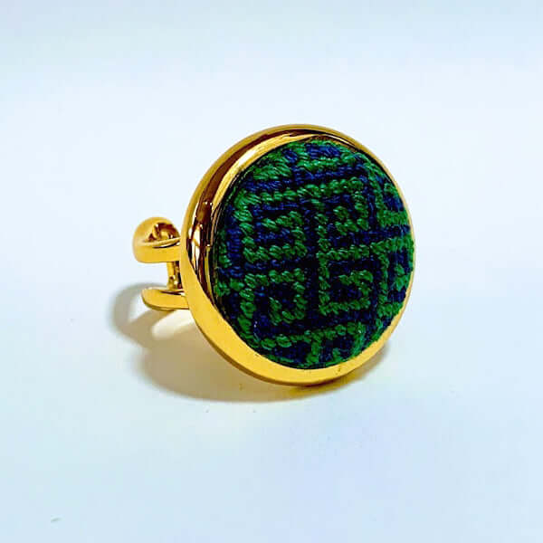 Navy & Kelly Greek Key Needlepoint Ring with adjustable arms, perfect as a scarf ring or charm, featuring unique design in gold and green.