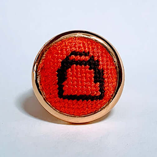 Orange & Brown Stirrup Gold Needlepoint Ring with adjustable arms, perfect for equestrians or as a versatile scarf and bridle charm.